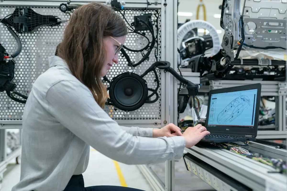 An engineer working at a laptop during a build