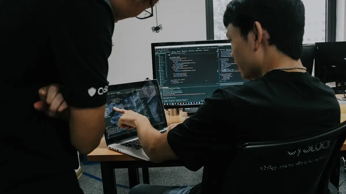 Two engineers working at adjacent computers