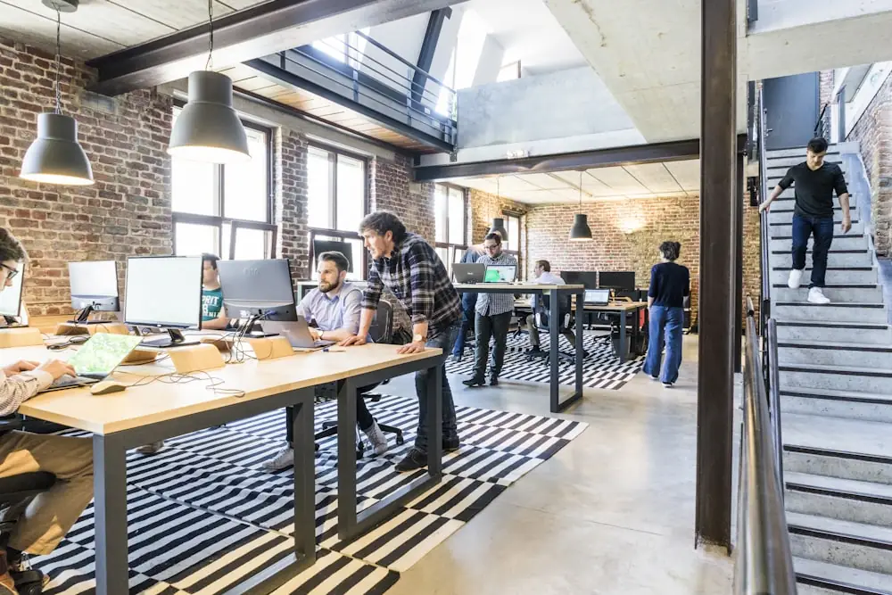 Two colleagues working together at a shared desk