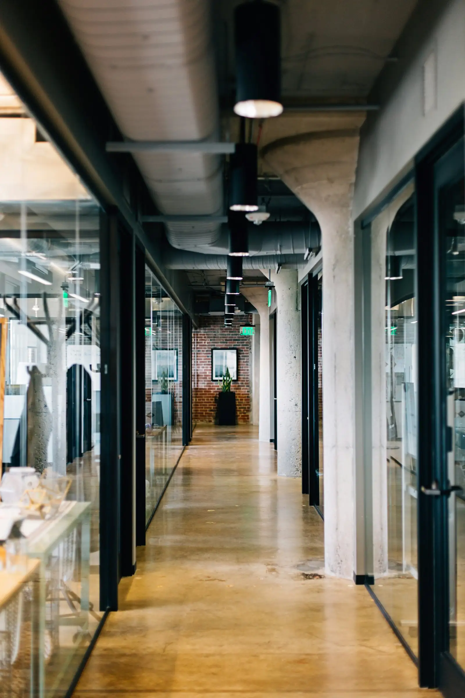 A long office corridor with exposed structure