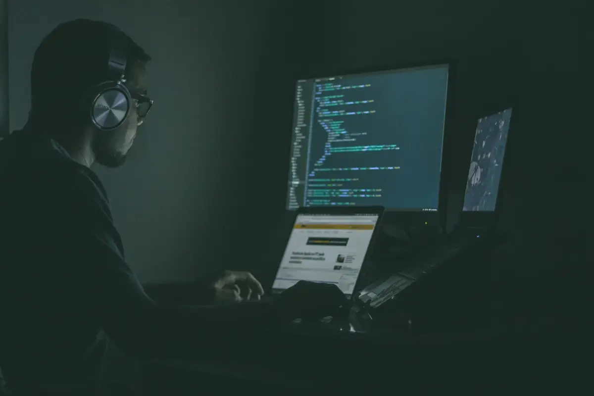 A developer working across multiple screens