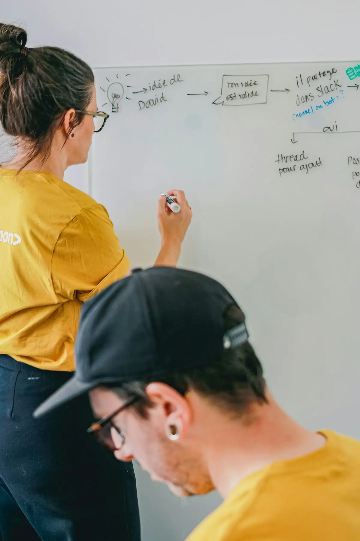 Two people reviewing system notes together